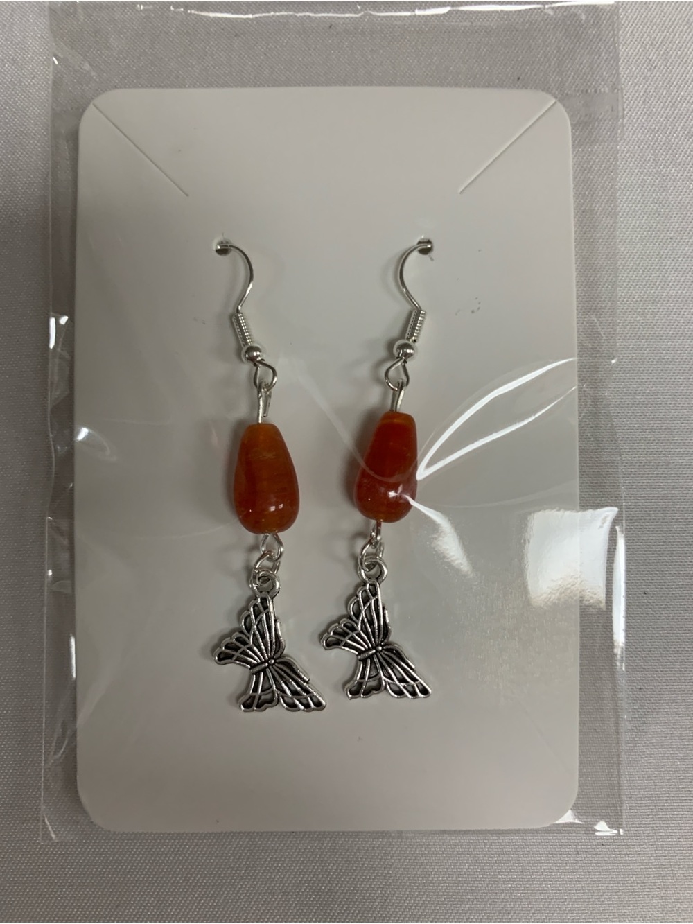 Silver Butterfly Drop Earrings with Orange Beads